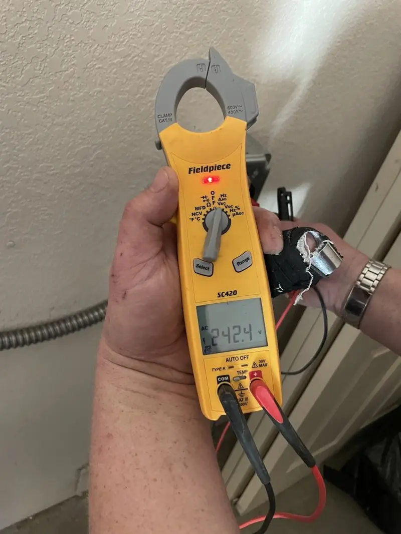 Voltage testing with clamp meter during Outlet Installation in Altadena